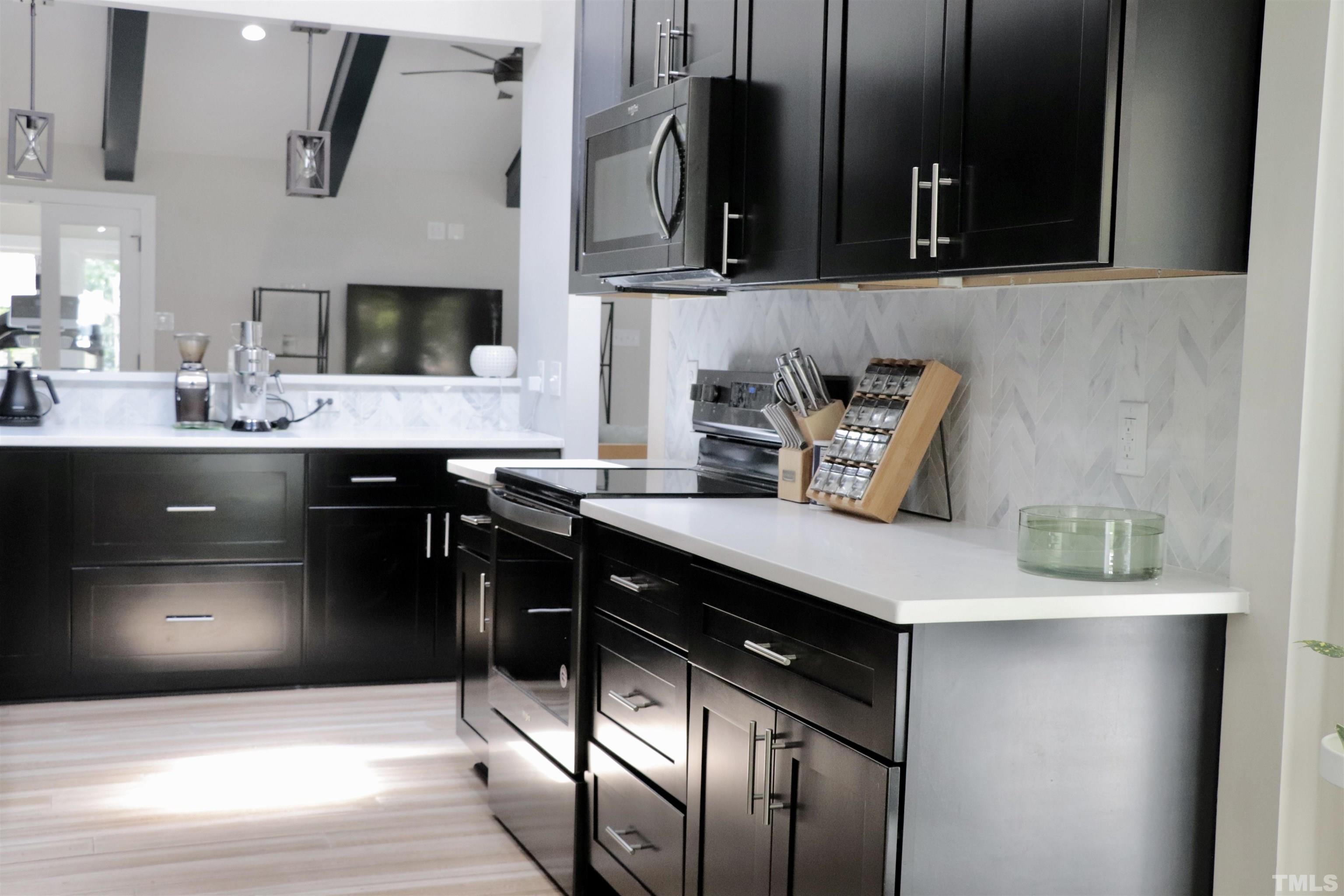 8001 Shellnut Road Raleigh, NC 27615 - Photo 7 of 22 a kitchen with a sink and cabinets