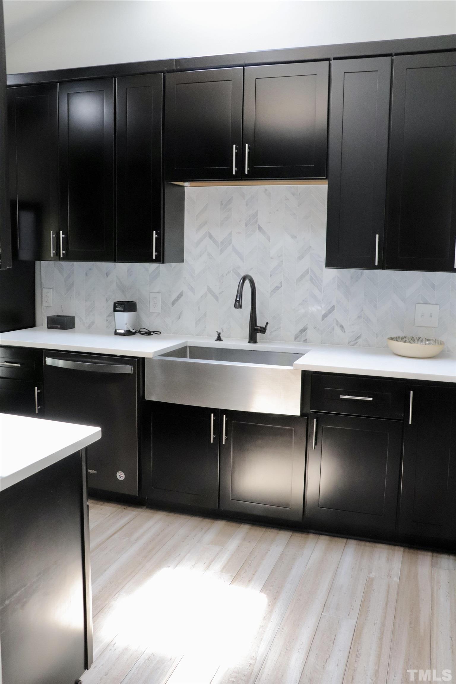 8001 Shellnut Road Raleigh, NC 27615 - Photo 9 of 22 a kitchen with a refrigerator and a sink