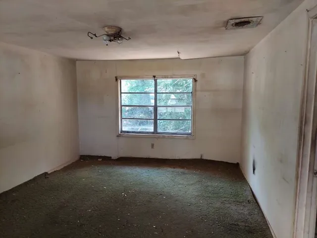an empty room with windows