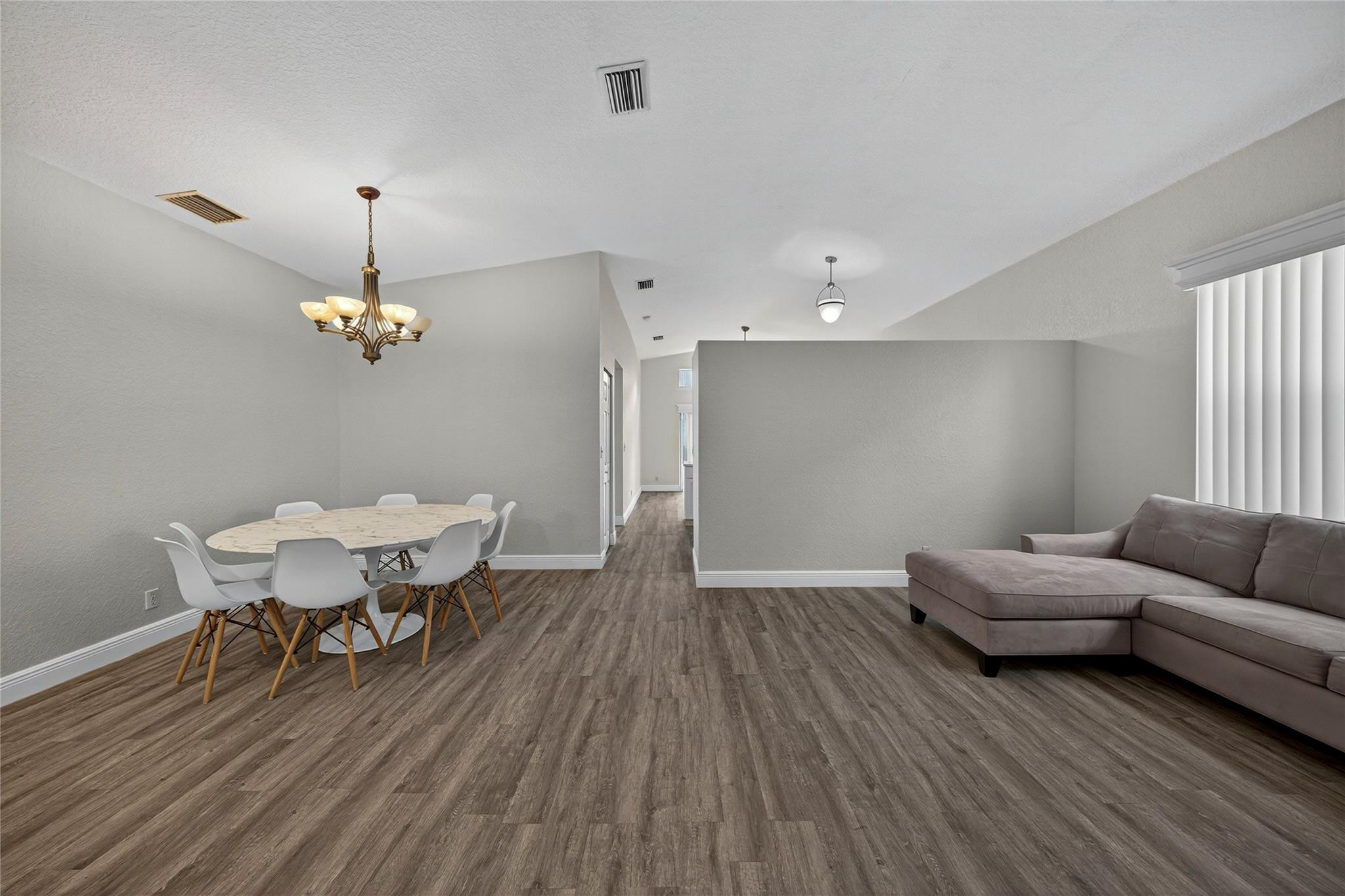 2424 Southwest 162nd Avenue Miramar, FL 33027 - Photo 14 of 44 a living room with furniture and a wooden floor