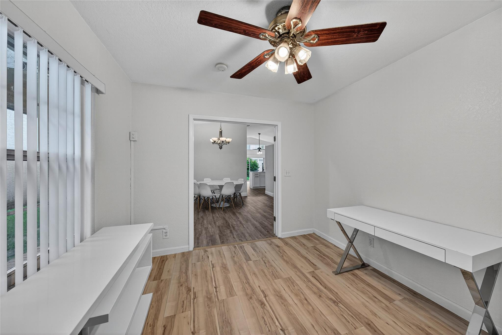 2424 Southwest 162nd Avenue Miramar, FL 33027 - Photo 18 of 44 a bedroom with a bed and a chandelier