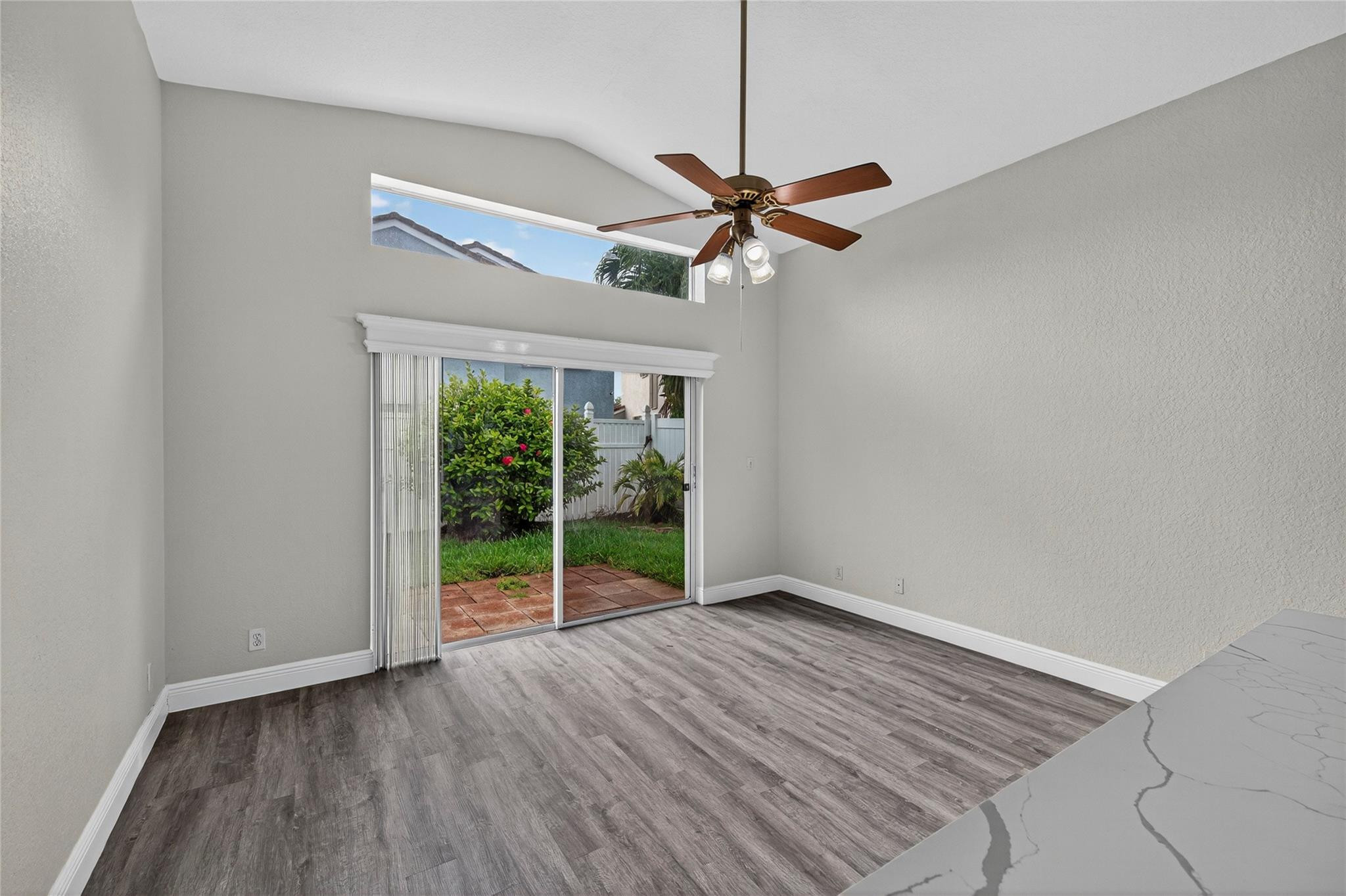 2424 Southwest 162nd Avenue Miramar, FL 33027 - Photo 22 of 44 a view of empty room with wooden floor and fan