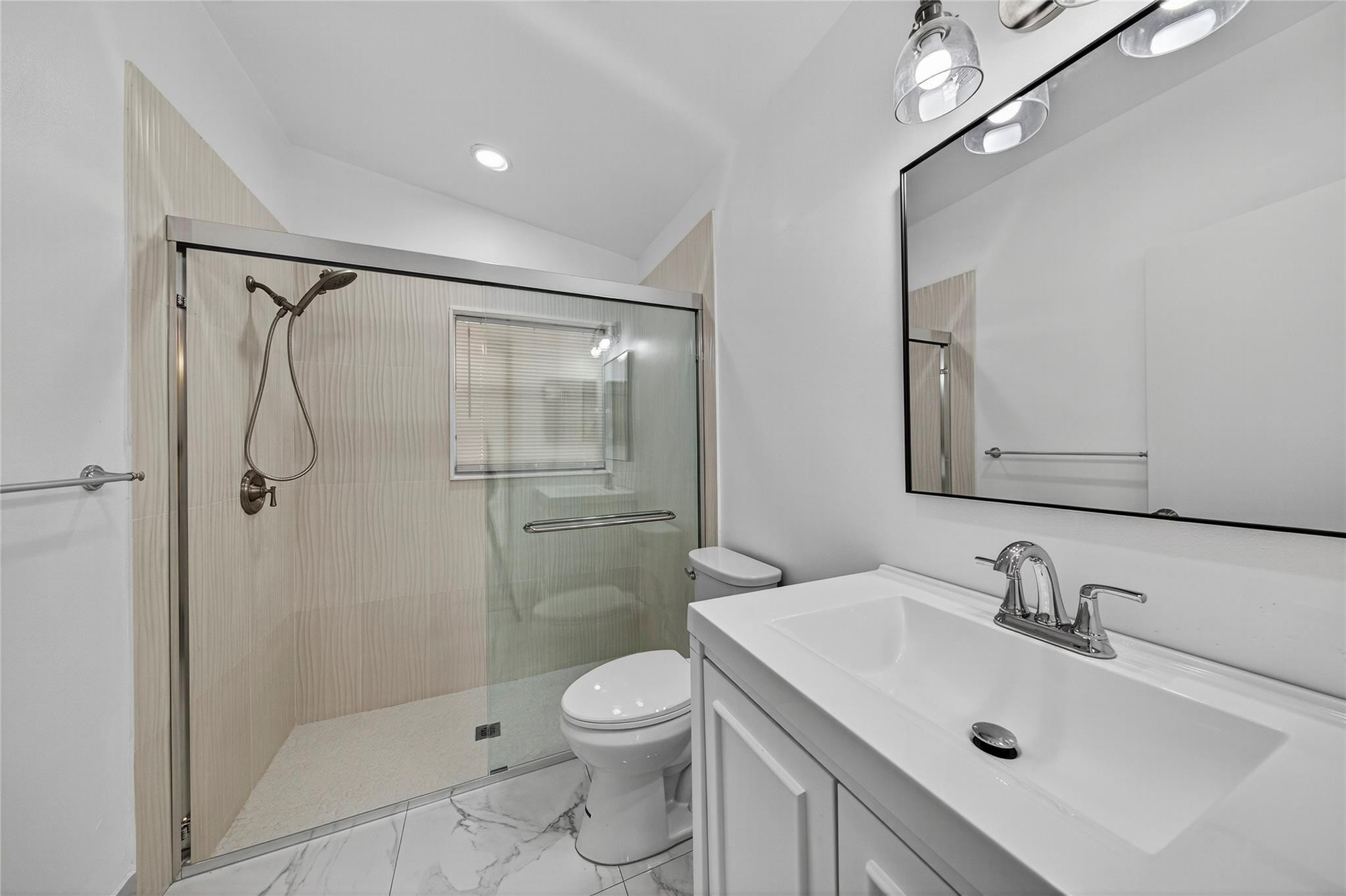 2424 Southwest 162nd Avenue Miramar, FL 33027 - Photo 26 of 44 a bathroom with a sink toilet and shower