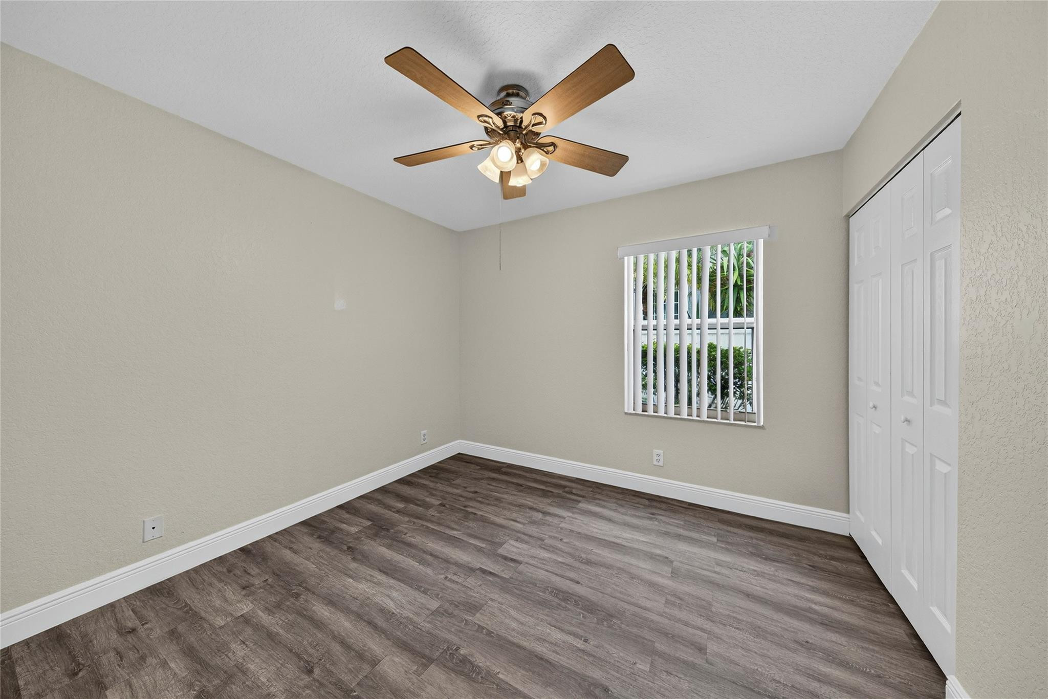 2424 Southwest 162nd Avenue Miramar, FL 33027 - Photo 32 of 44 wooden floor in an empty room with a window