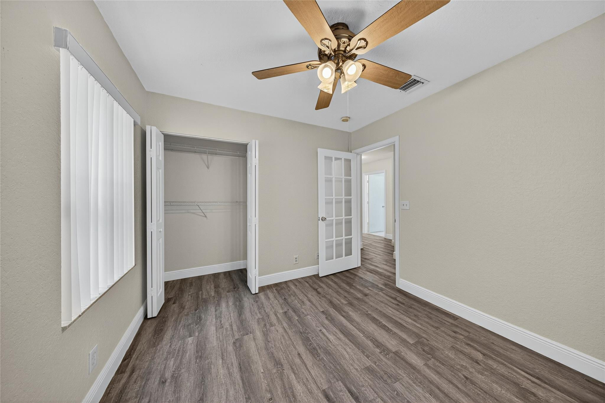 2424 Southwest 162nd Avenue Miramar, FL 33027 - Photo 33 of 44 wooden floor in an empty room with a window