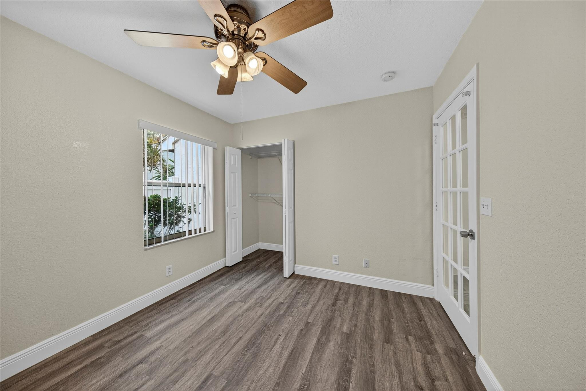 2424 Southwest 162nd Avenue Miramar, FL 33027 - Photo 34 of 44 wooden floor in an empty room with a window
