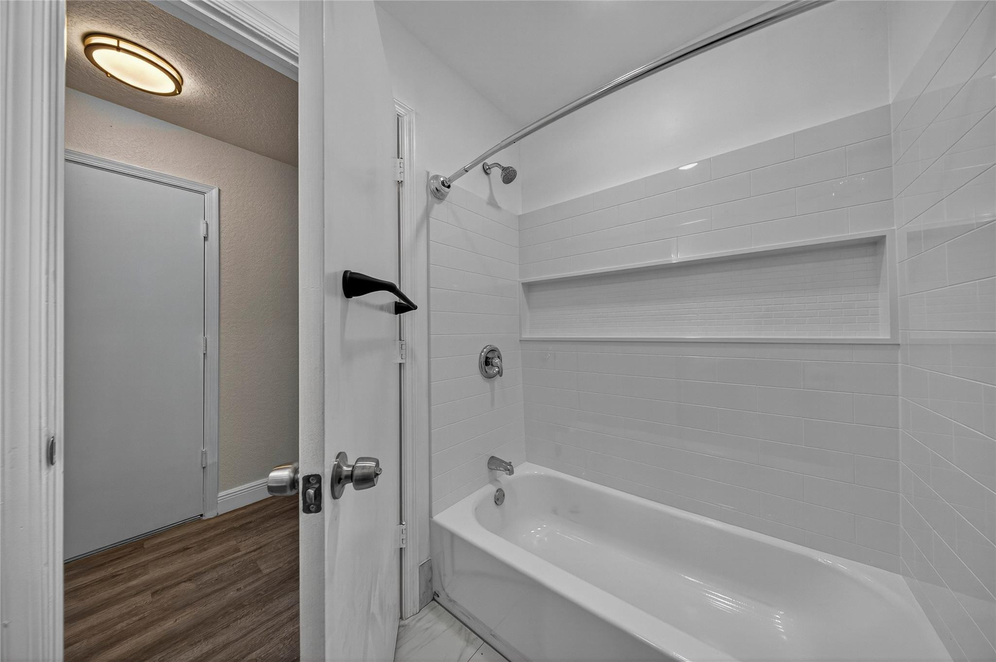 2424 Southwest 162nd Avenue Miramar, FL 33027 - Photo 36 of 44 a bathroom with a bathtub and a shower