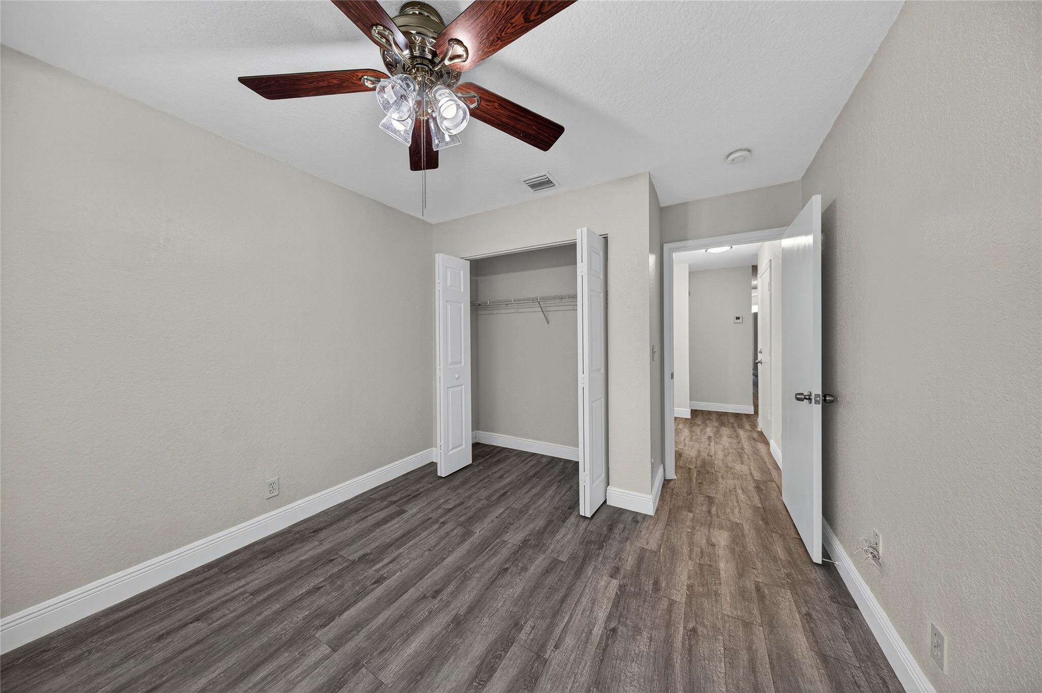 2424 Southwest 162nd Avenue Miramar, FL 33027 - Photo 38 of 44 wooden floor in an empty room with a window