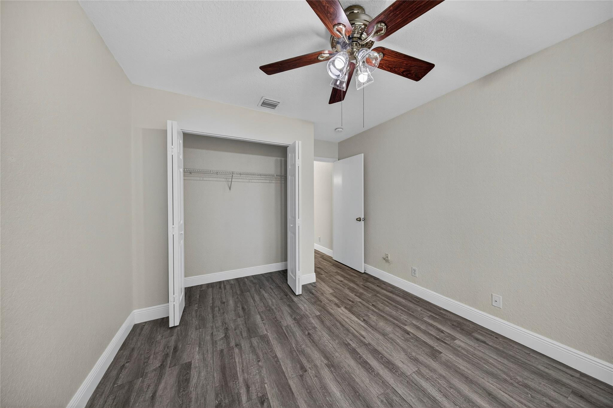 2424 Southwest 162nd Avenue Miramar, FL 33027 - Photo 39 of 44 wooden floor in an empty room with a window