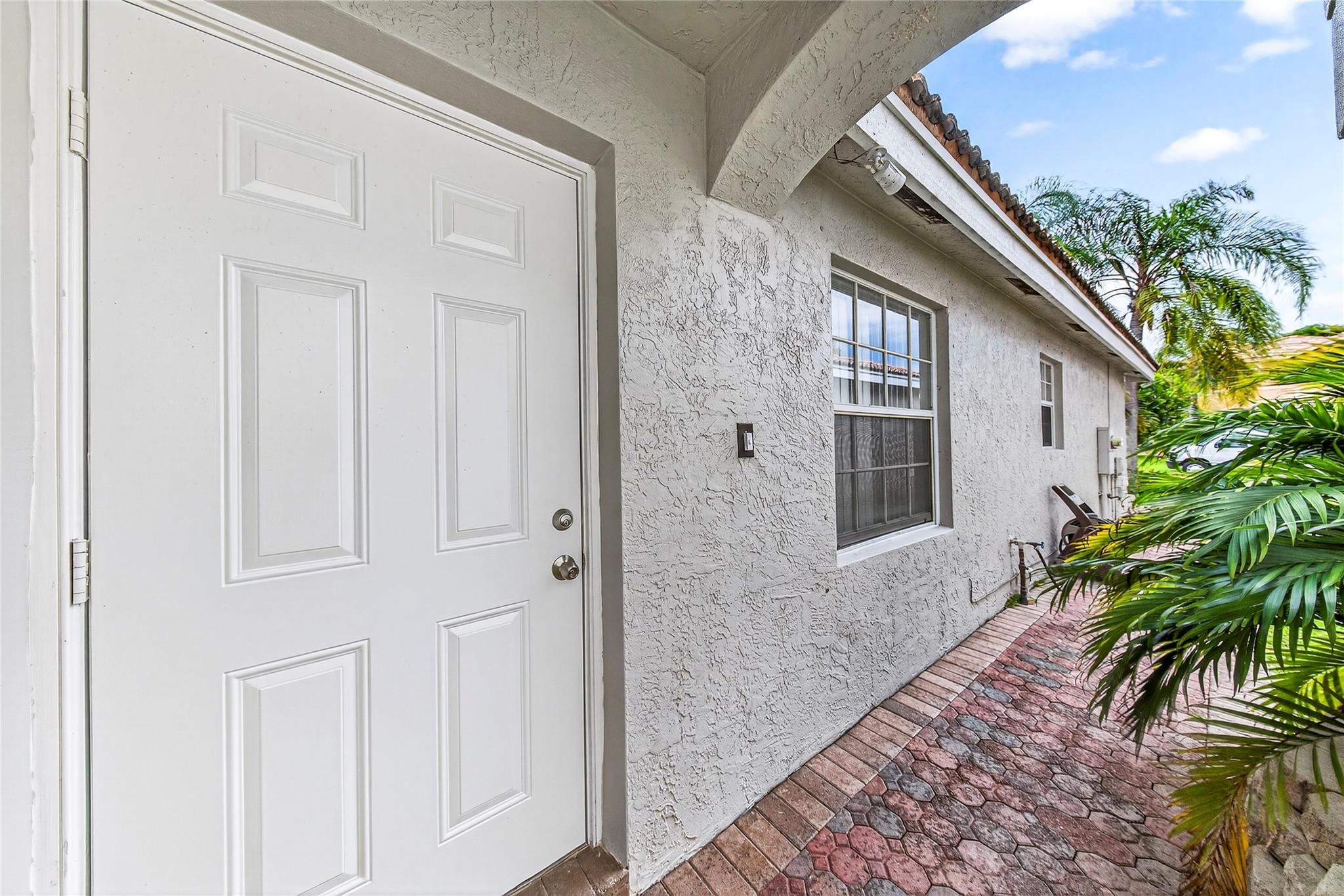 2424 Southwest 162nd Avenue Miramar, FL 33027 - Photo 6 of 44 a view of a house with a glass door