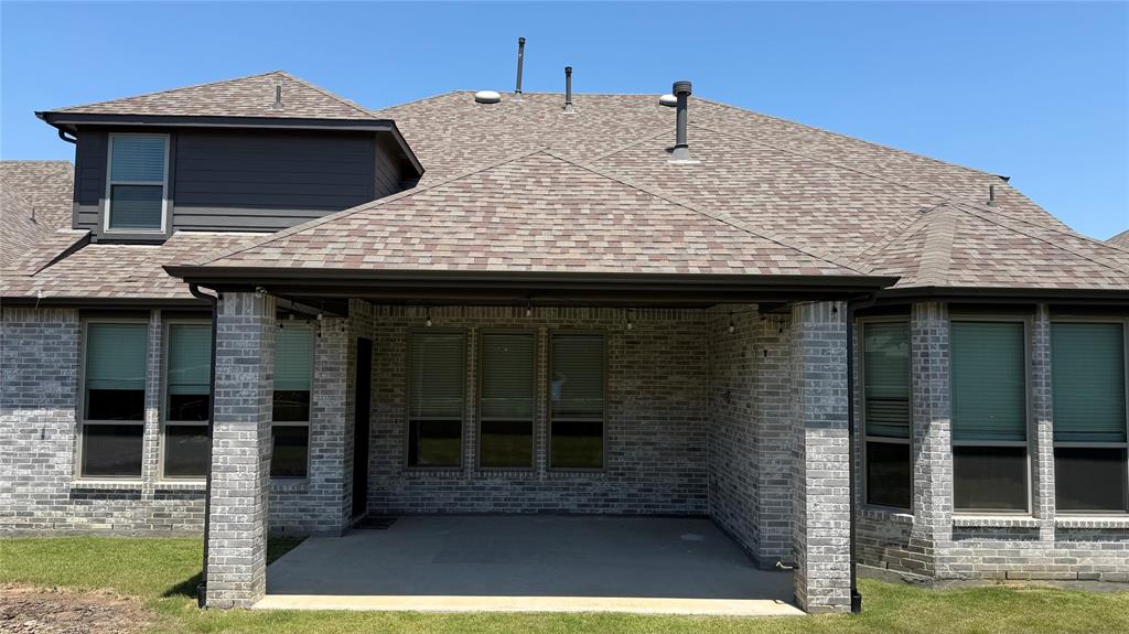 9628 Boulder Pt Road Oak Point, TX 75068 - Photo 26 of 35 Covered patio area featuring brick pillars, string lighting, and direct access to interior spaces
