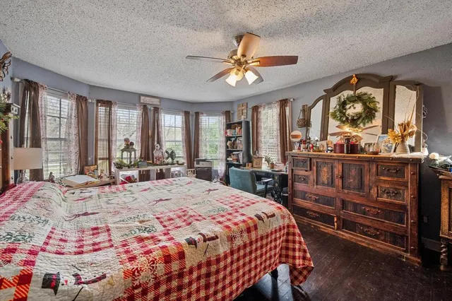 a living room with furniture and a baby crib