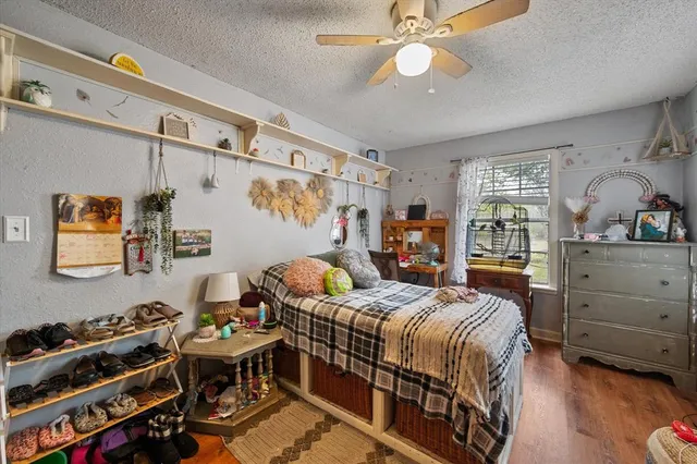 a bathroom with a sink vanity mirror and toilet