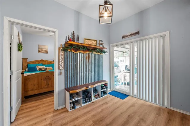 a bedroom with furniture and a window