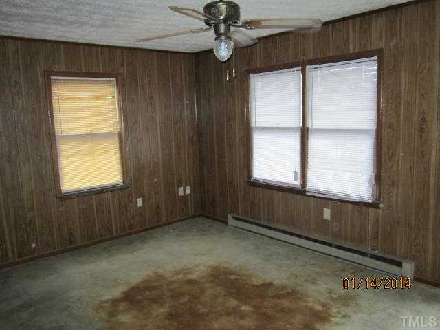 920 Old Allensville Road Roxboro, NC 27574 - Photo 5 of 10 a view of an empty room with a window