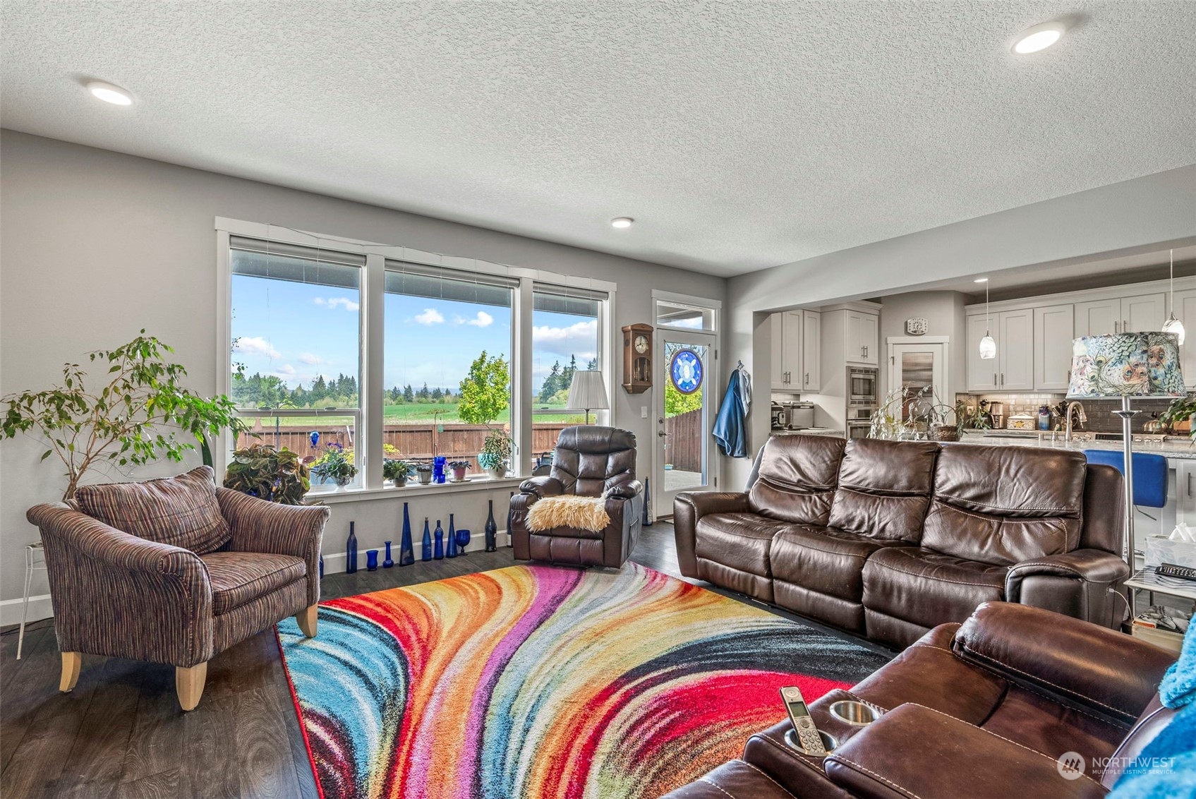 4578 North Noble Loop Ridgefield, WA 98642 - Photo 17 of 40 a living room with furniture and a large window