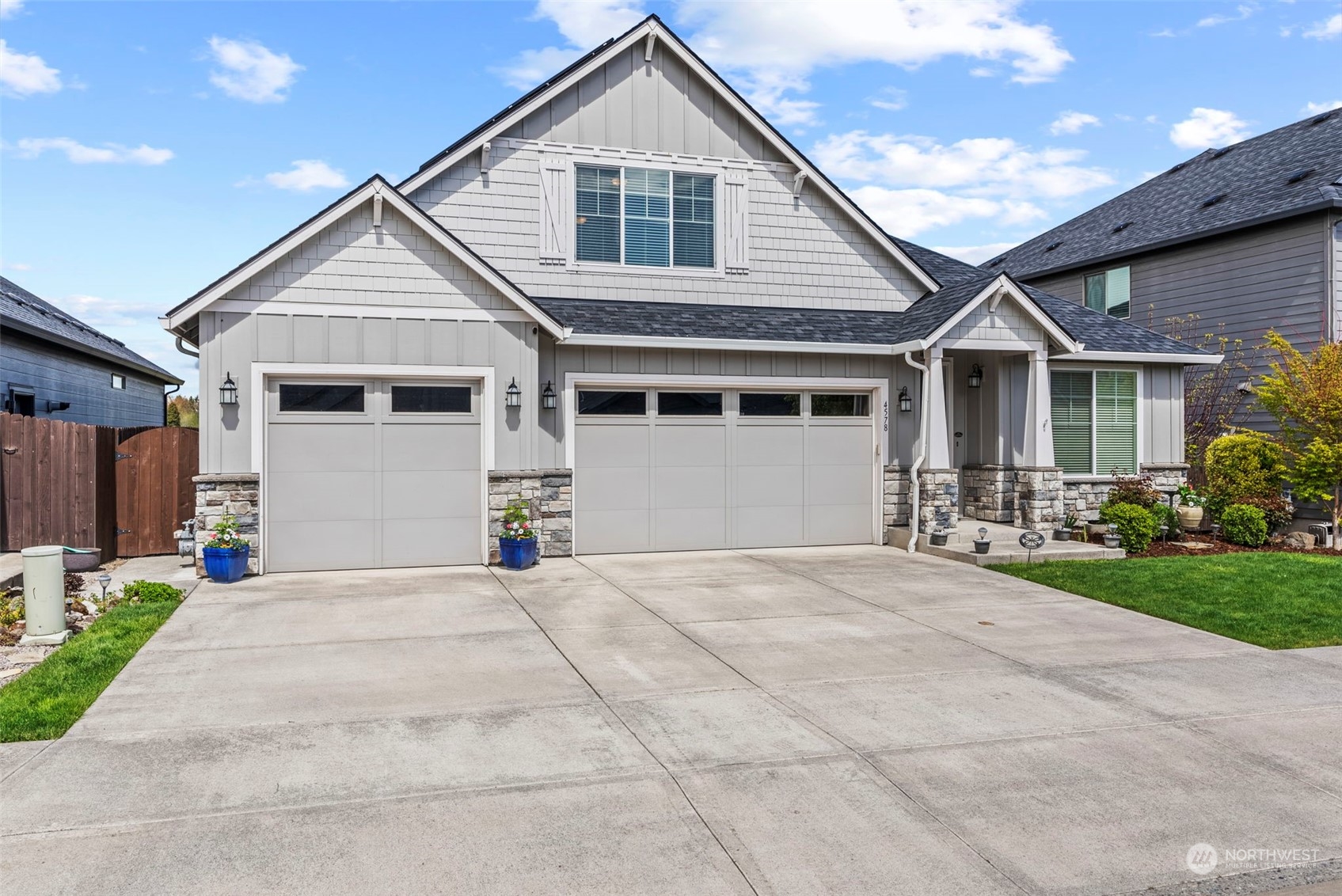 4578 North Noble Loop Ridgefield, WA 98642 - Photo 2 of 40 a view of a house with a yard and potted plants