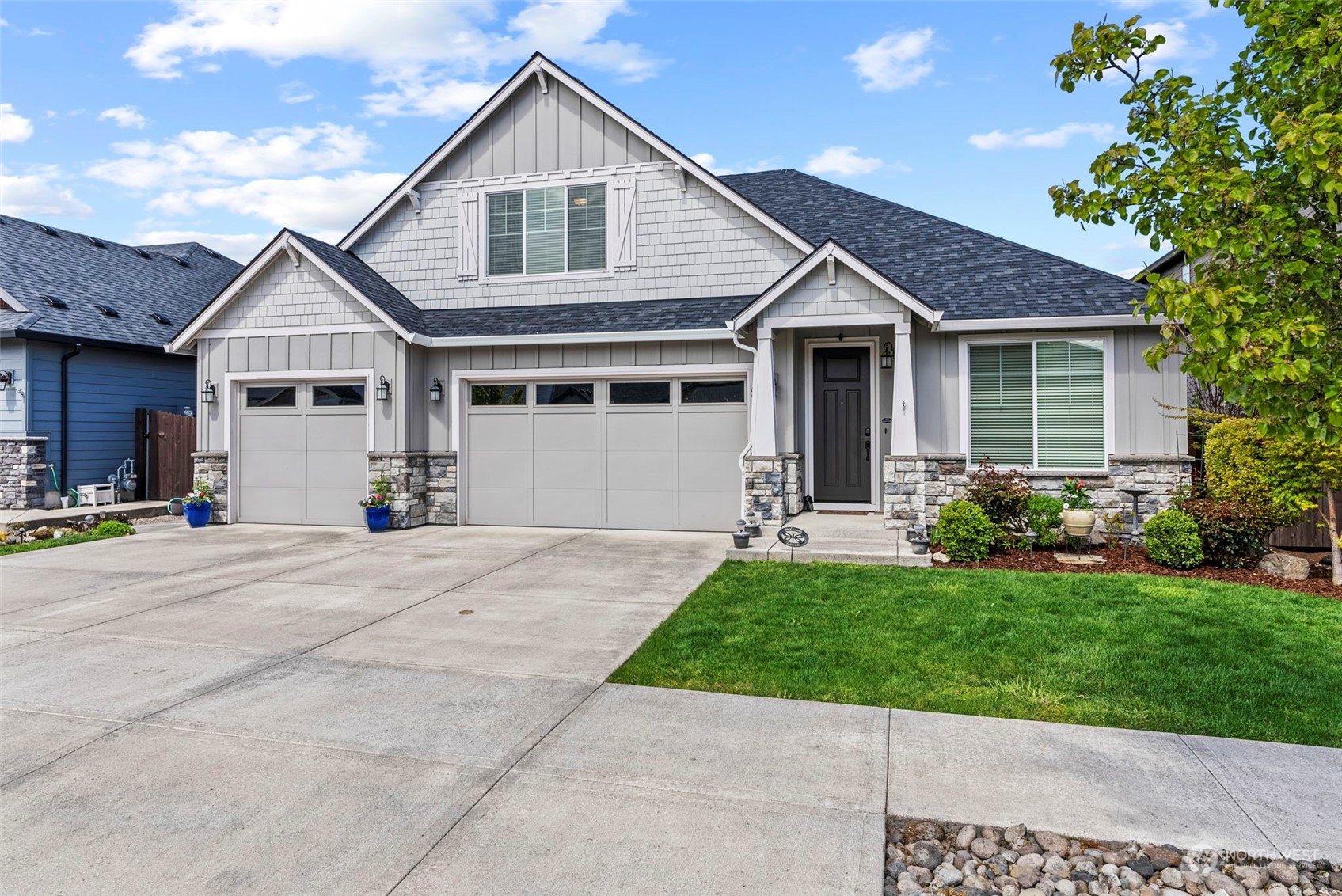 4578 North Noble Loop Ridgefield, WA 98642 - Photo 3 of 40 a view of a house with a yard and potted plants