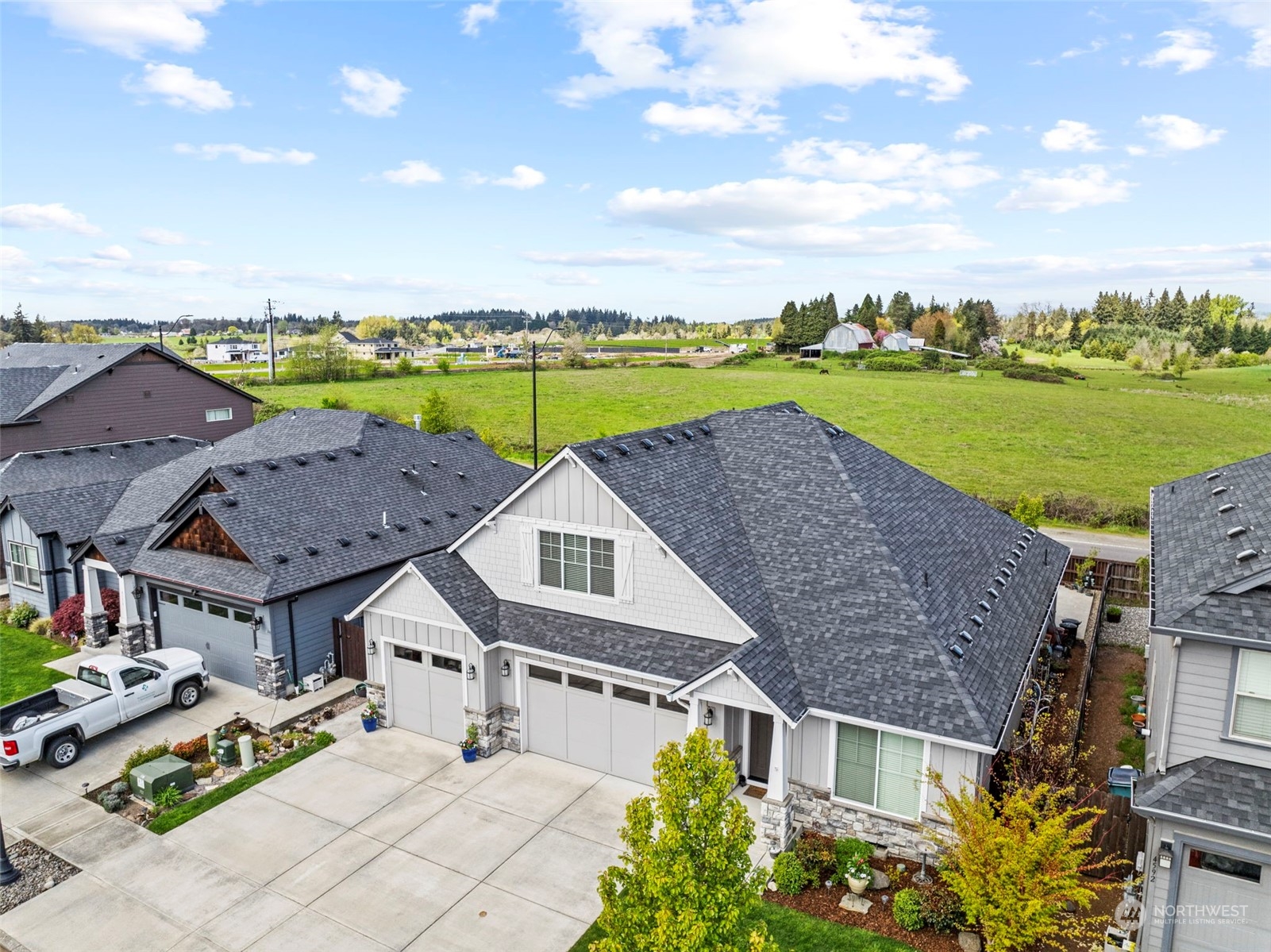 4578 North Noble Loop Ridgefield, WA 98642 - Photo 5 of 40 an aerial view of a house with a garden and lake view