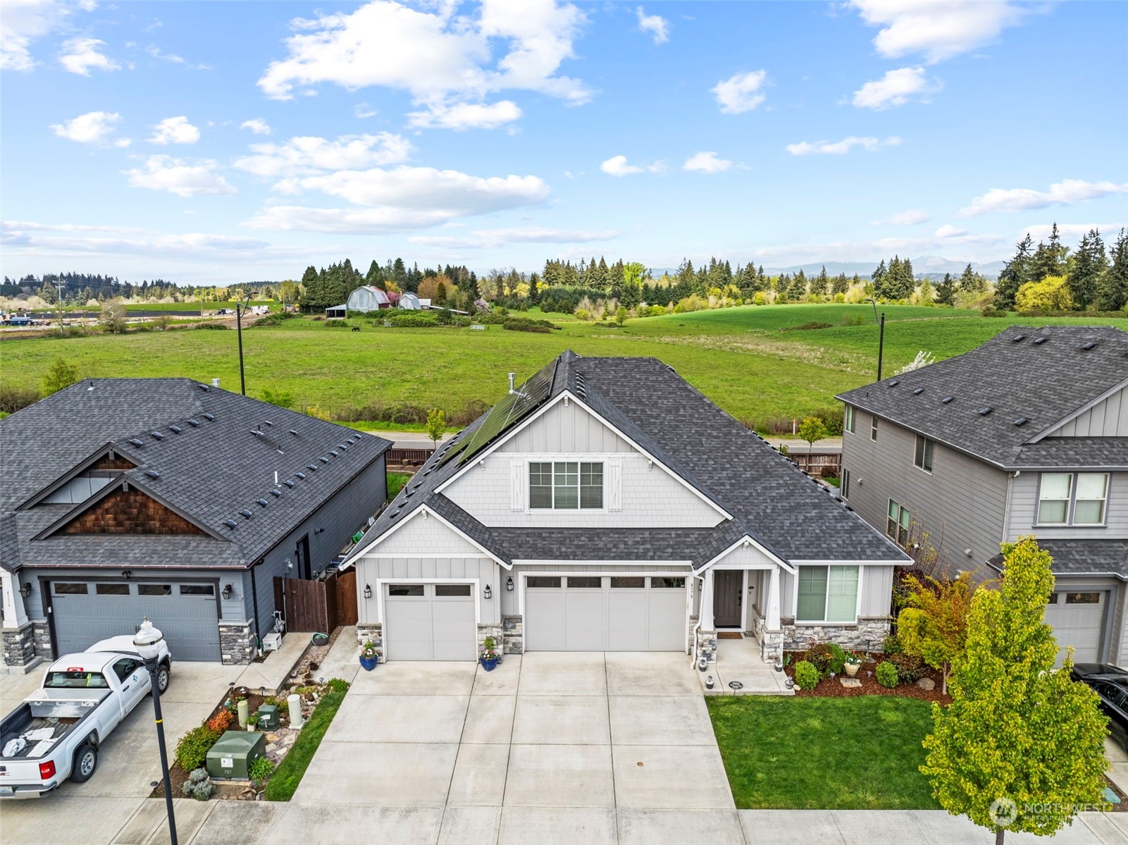 4578 North Noble Loop Ridgefield, WA 98642 - Photo 6 of 40 a view of a big house with a big yard and large trees
