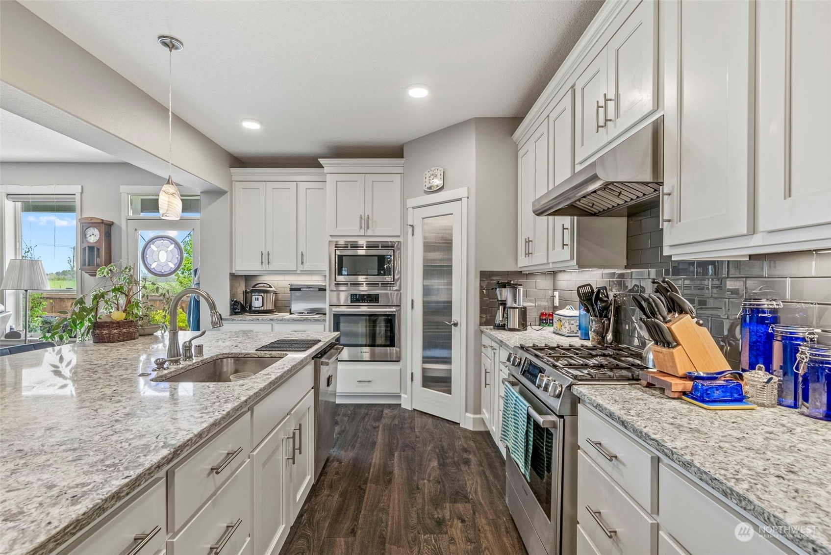 4578 North Noble Loop Ridgefield, WA 98642 - Photo 9 of 40 a kitchen with stainless steel appliances granite countertop a sink stove and refrigerator