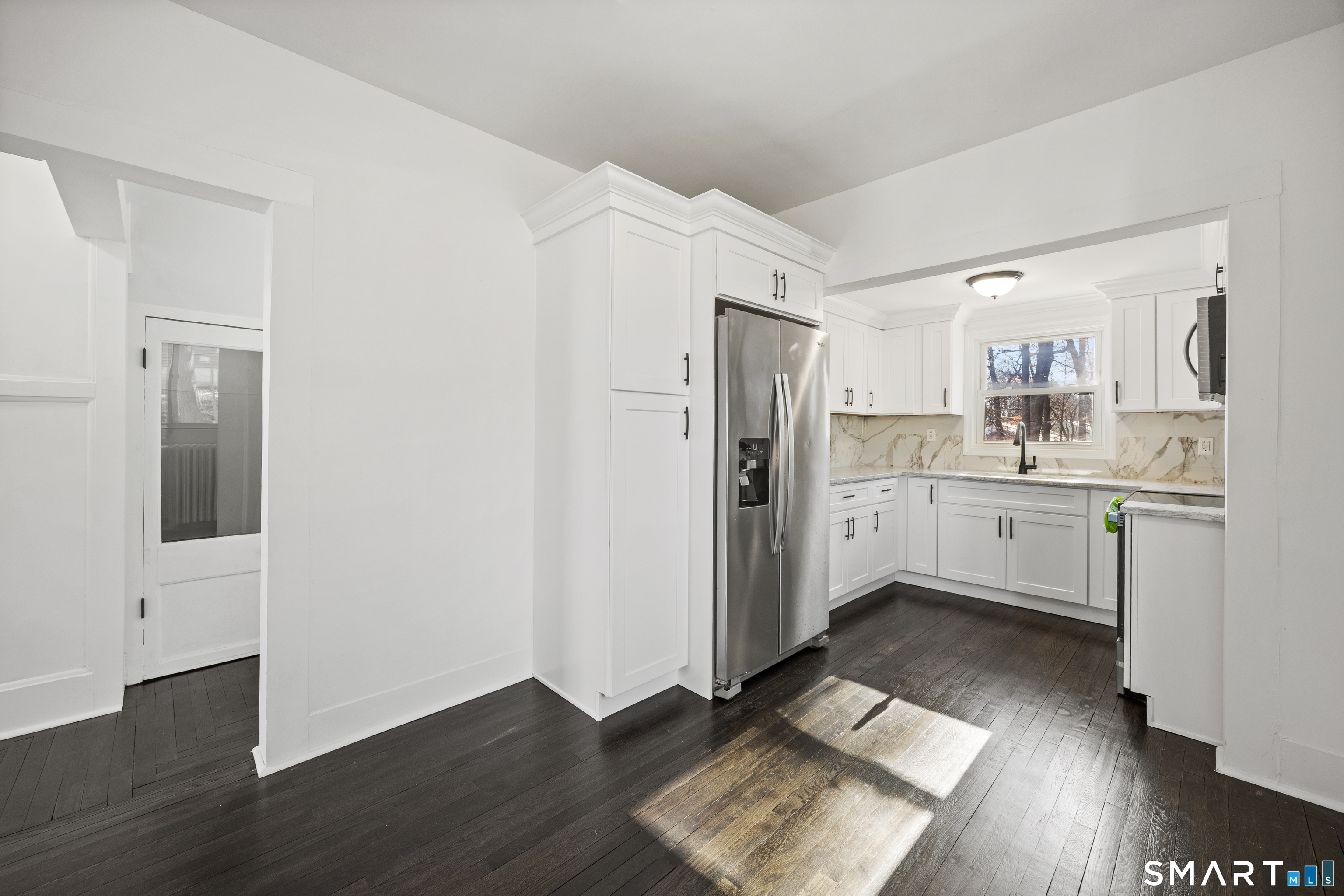 148 Burwell Road West Haven, CT 06516 - Photo 12 of 33 a kitchen with stainless steel appliances a refrigerator sink and cabinets