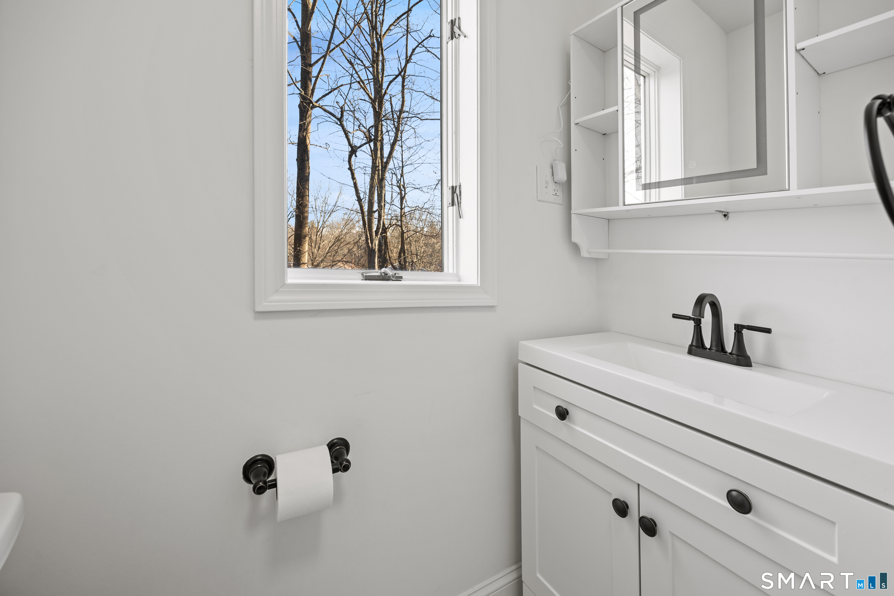 148 Burwell Road West Haven, CT 06516 - Photo 13 of 33 a bathroom with a sink and cabinets