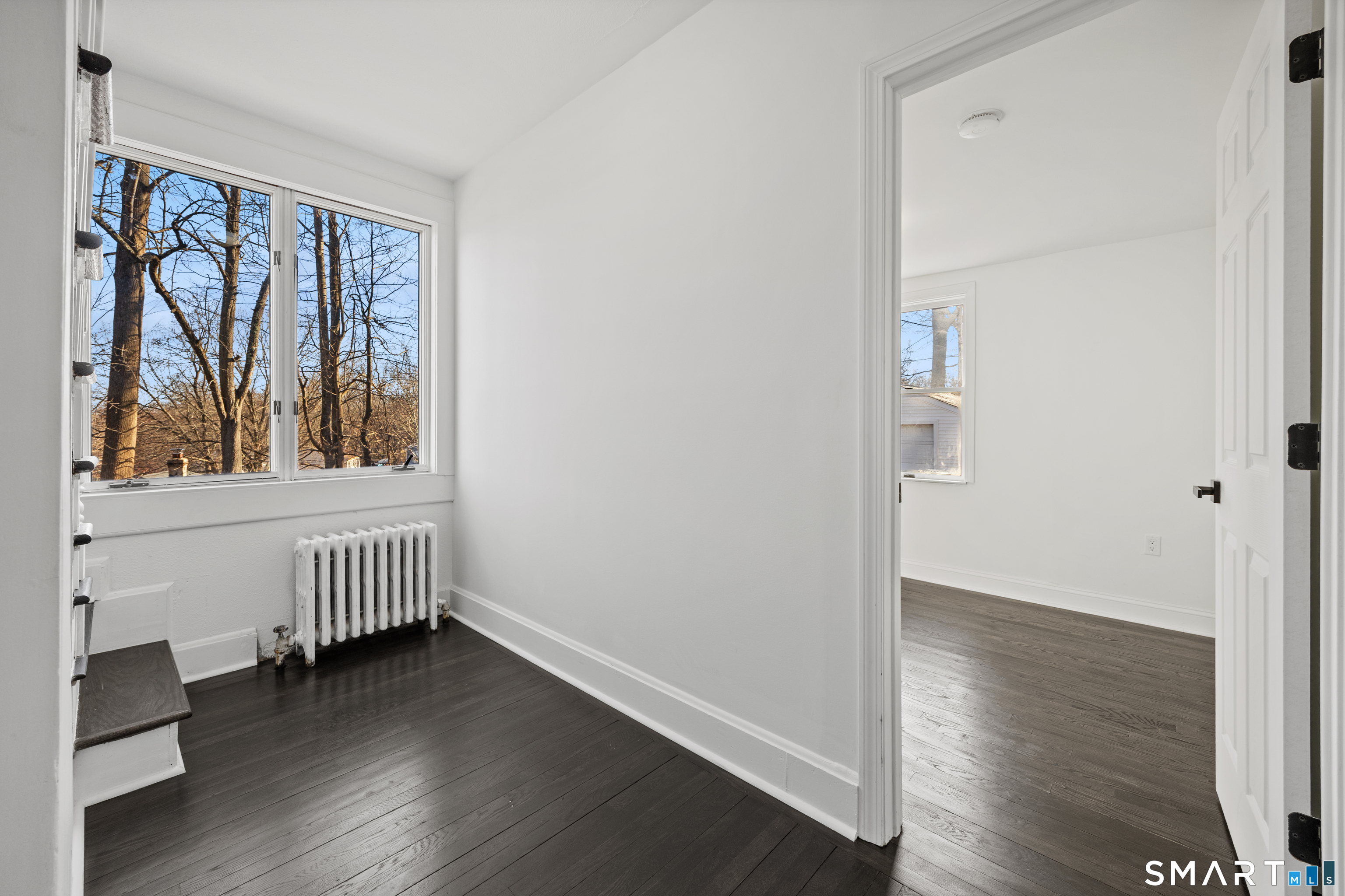 148 Burwell Road West Haven, CT 06516 - Photo 15 of 33 an empty room with wooden floor and windows