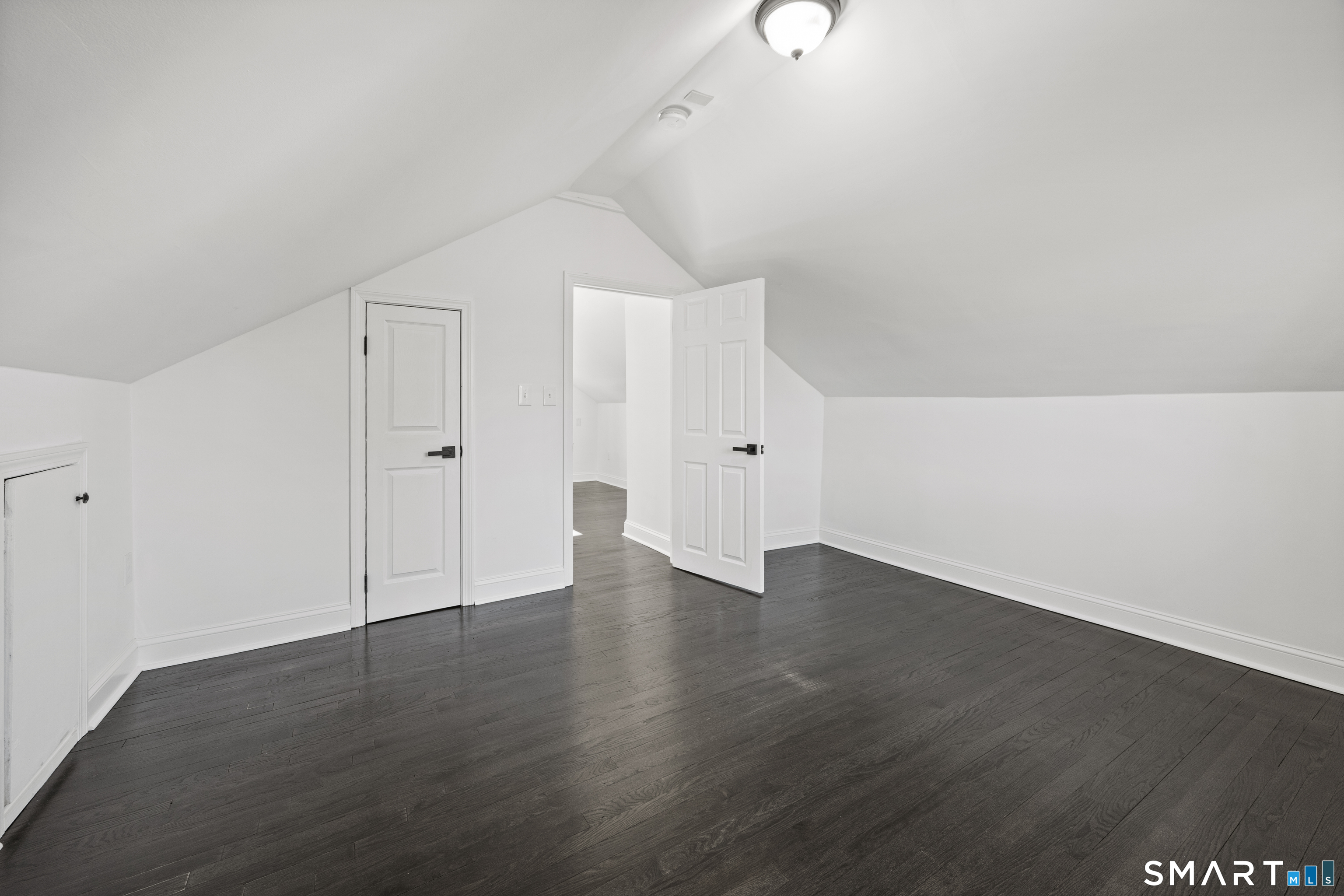 148 Burwell Road West Haven, CT 06516 - Photo 20 of 33 a view of an empty room with wooden floor