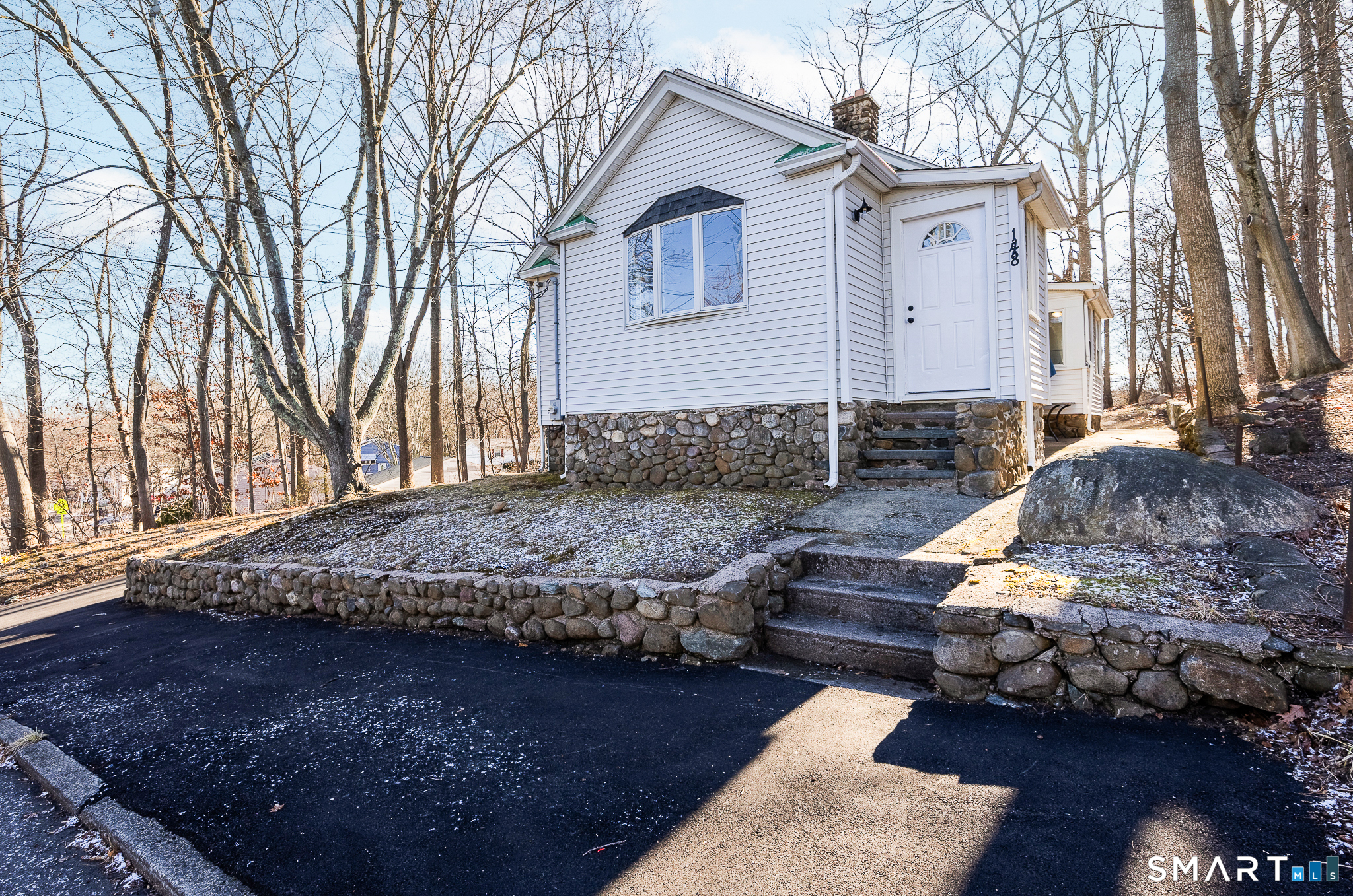 148 Burwell Road West Haven, CT 06516 - Photo 2 of 33 a view of a house with a yard covered with snow