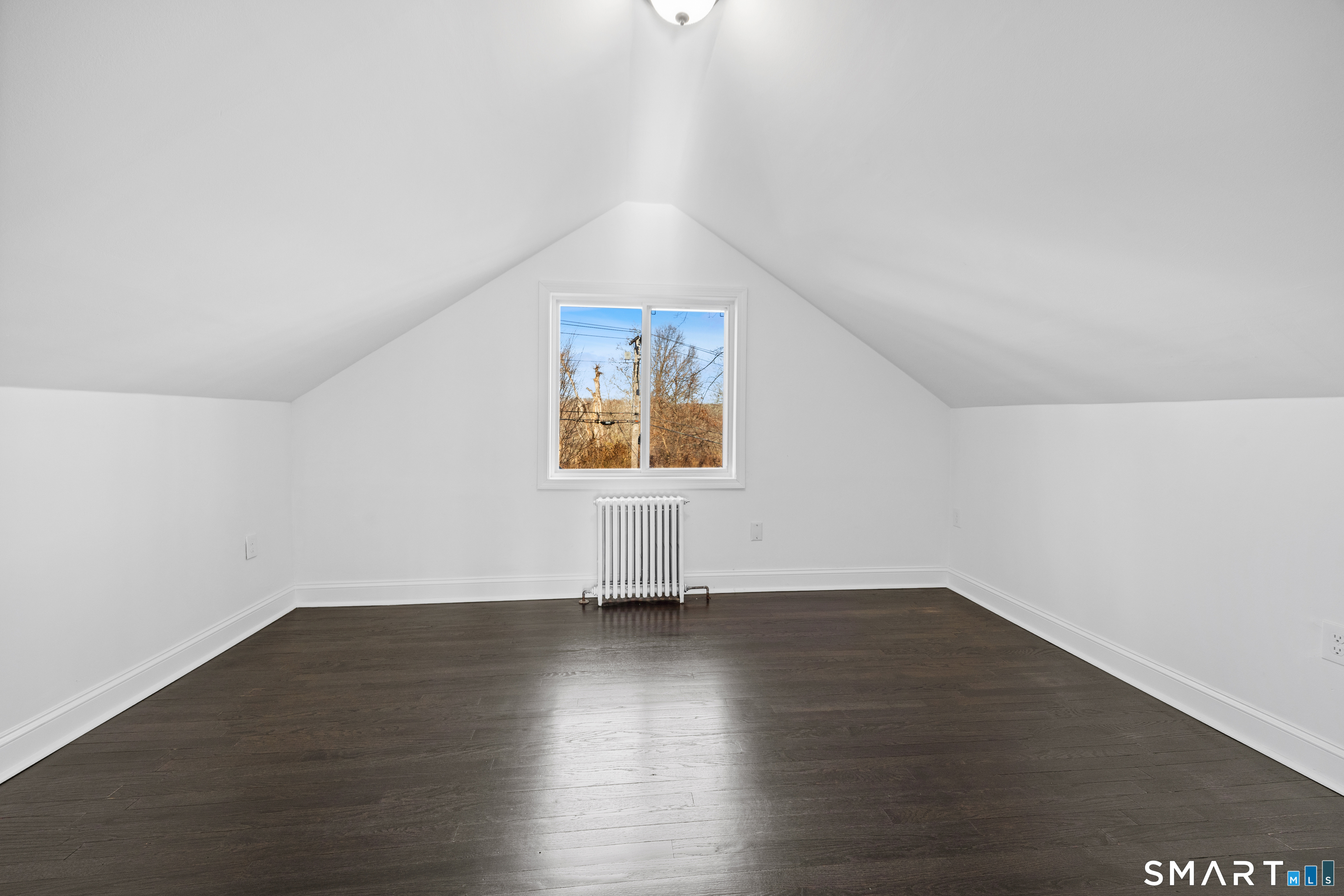 148 Burwell Road West Haven, CT 06516 - Photo 22 of 33 an empty room with wooden floor and windows