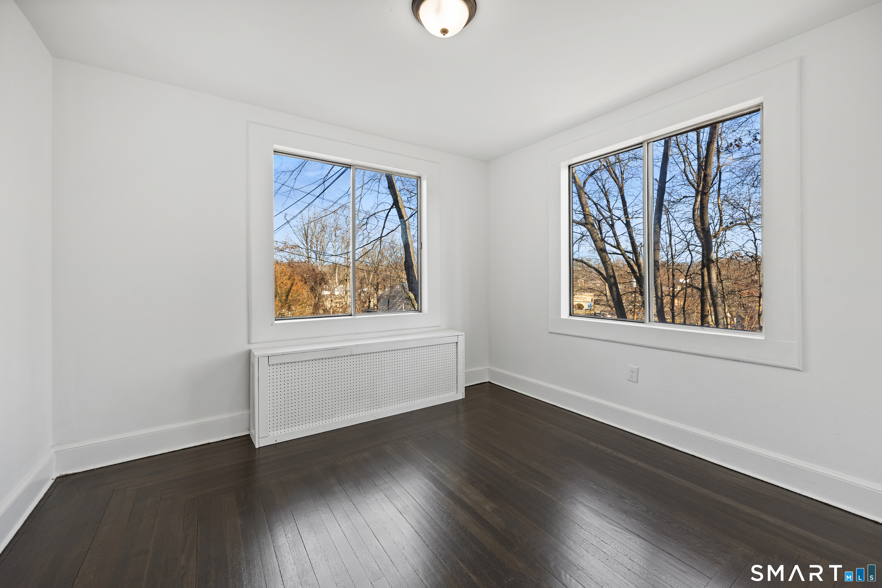 148 Burwell Road West Haven, CT 06516 - Photo 25 of 33 wooden floor in an empty room with a window