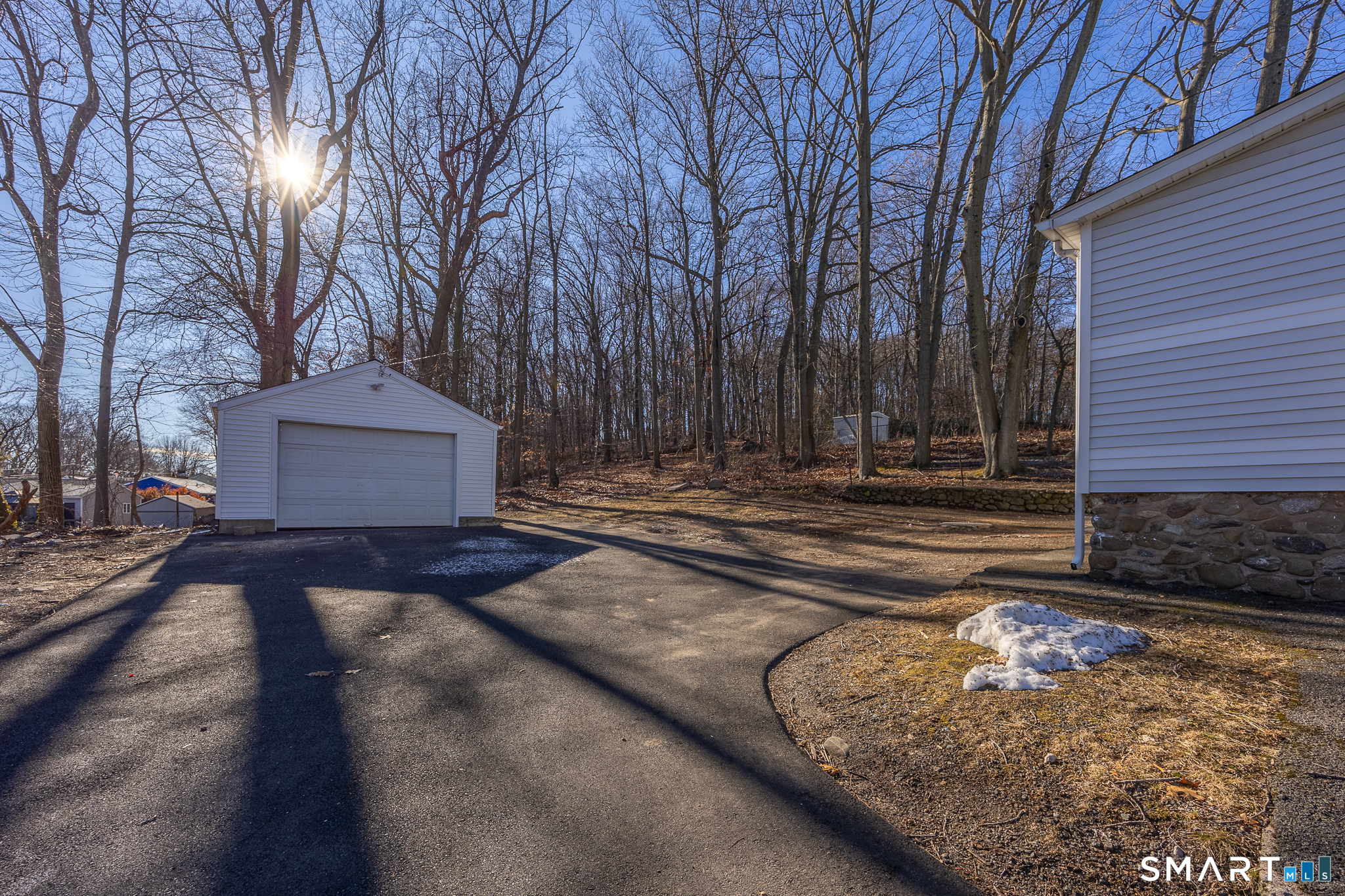 148 Burwell Road West Haven, CT 06516 - Photo 30 of 33 a view of a house with a yard covered with snow