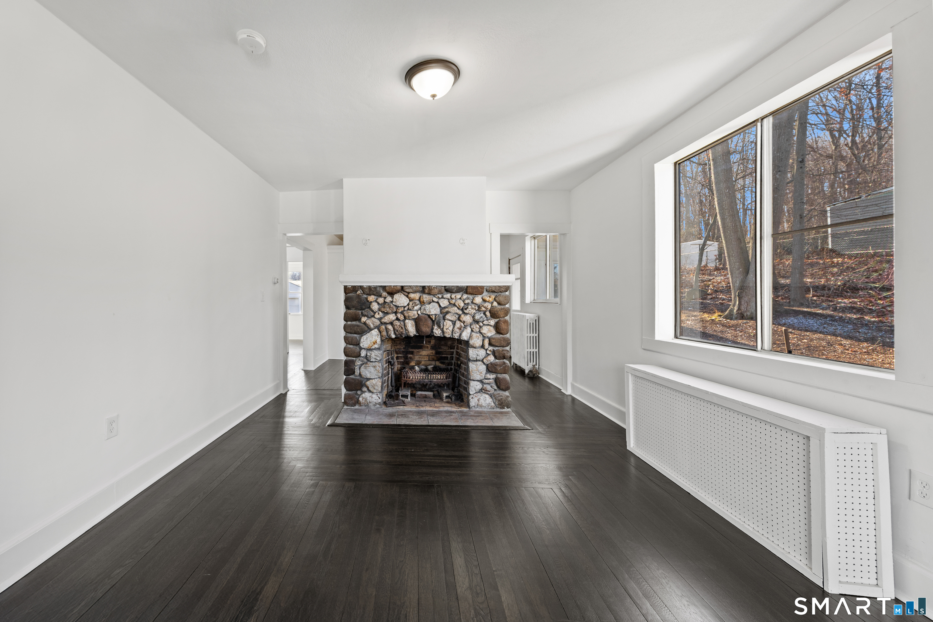148 Burwell Road West Haven, CT 06516 - Photo 5 of 33 a living room with fireplace furniture and a large window