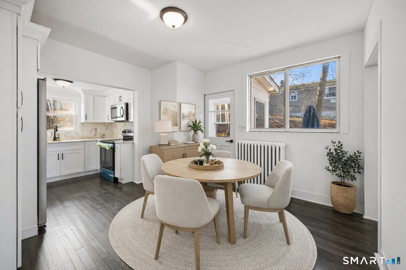 148 Burwell Road West Haven, CT 06516 - Photo 8 of 33 a view of a dining room with furniture and wooden floor
