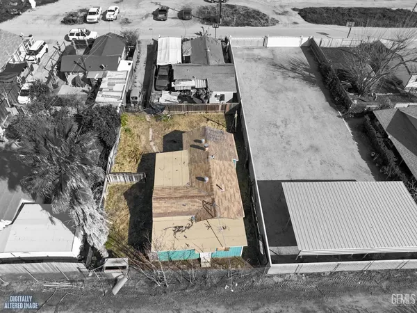 an aerial view of a house with outdoor space