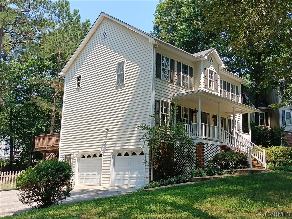 3206 Ludgate Road Chester, VA 23831 - Photo 3 of 45 a front view of a house with a yard and trees