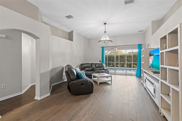 a living room with furniture and a window