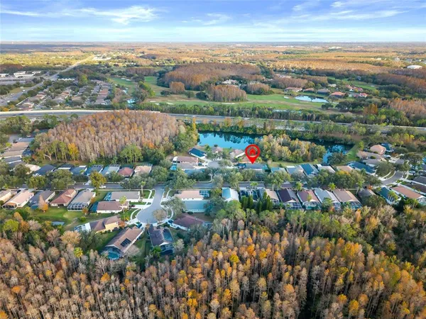 an aerial view of residential houses with outdoor space