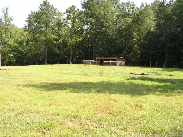 1055 Johnny Shaw Road Moncure, NC 27559 - Photo 12 of 12 Stalls for livestock in pasture.