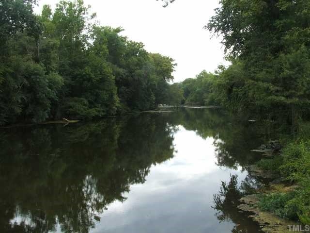 1055 Johnny Shaw Road Moncure, NC 27559 - Photo 4 of 12 Rocky River frontage. Gorgeous section of the river. Enjoy relaxing evenings by the water.