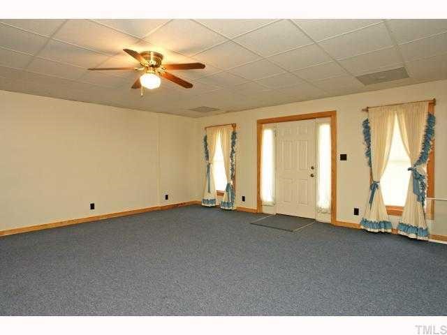 1055 Johnny Shaw Road Moncure, NC 27559 - Photo 9 of 12 Open area in basement for family fun.