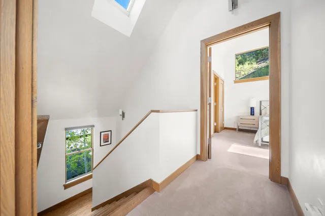 a view of a hallway with a livingroom and a hallway