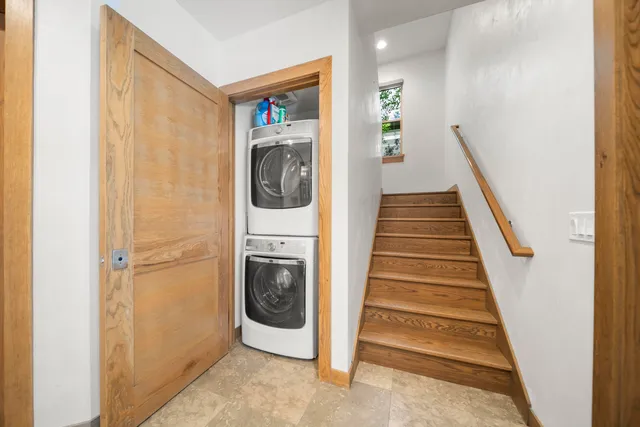 a view of a hallway with washer and dryer
