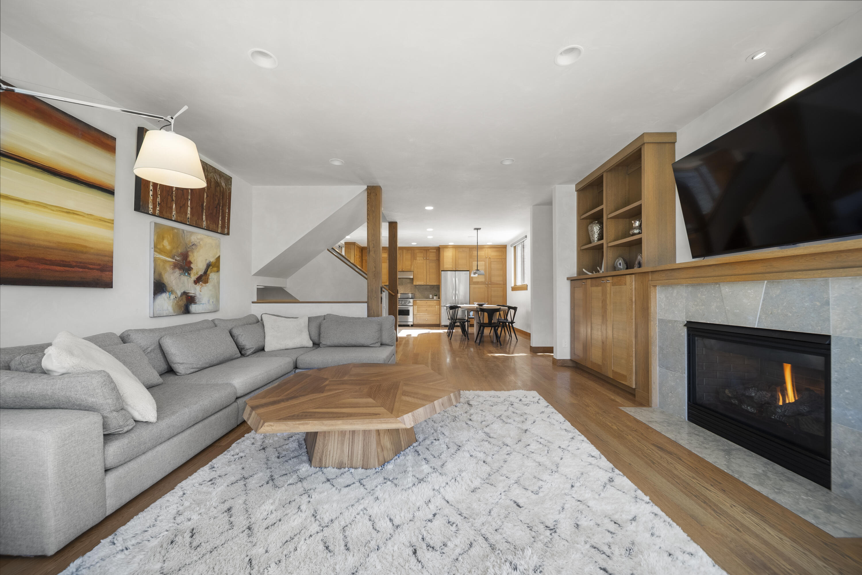 245 South Sunset Ridge Drive Telluride, CO 81435 - Photo 2 of 26 a living room with furniture and a fireplace