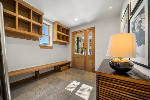 a living room with a rug and a window