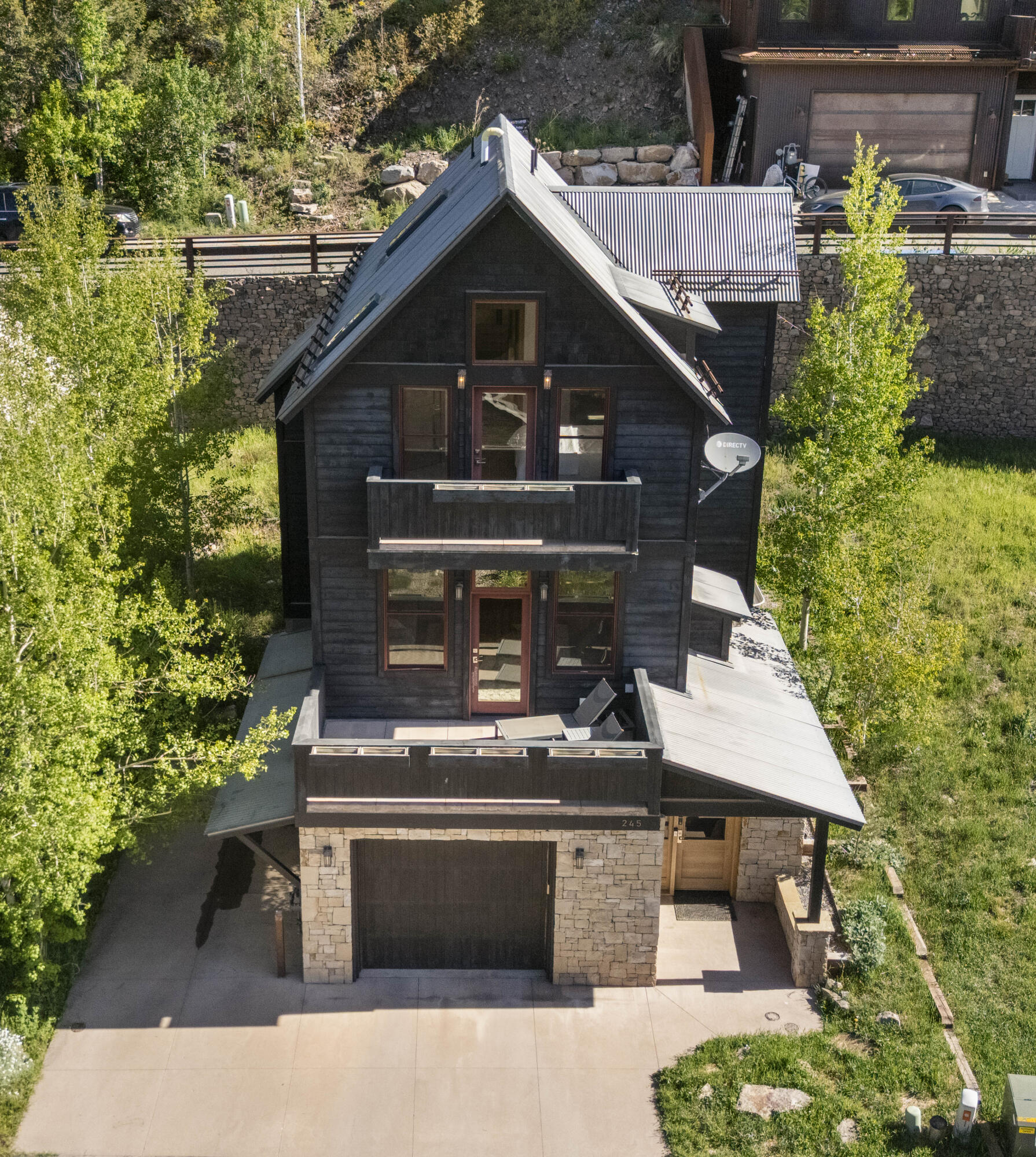 245 South Sunset Ridge Drive Telluride, CO 81435 - Photo 26 of 26 a front view of a house with a garden