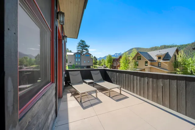 a view of balcony with furniture