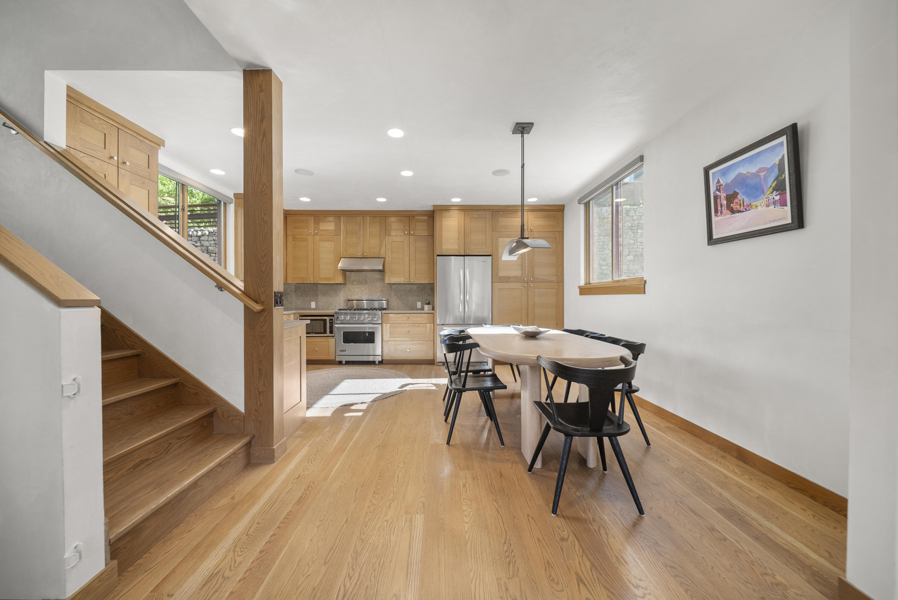 245 South Sunset Ridge Drive Telluride, CO 81435 - Photo 7 of 26 a view of a dining room with furniture a chandelier and wooden floor
