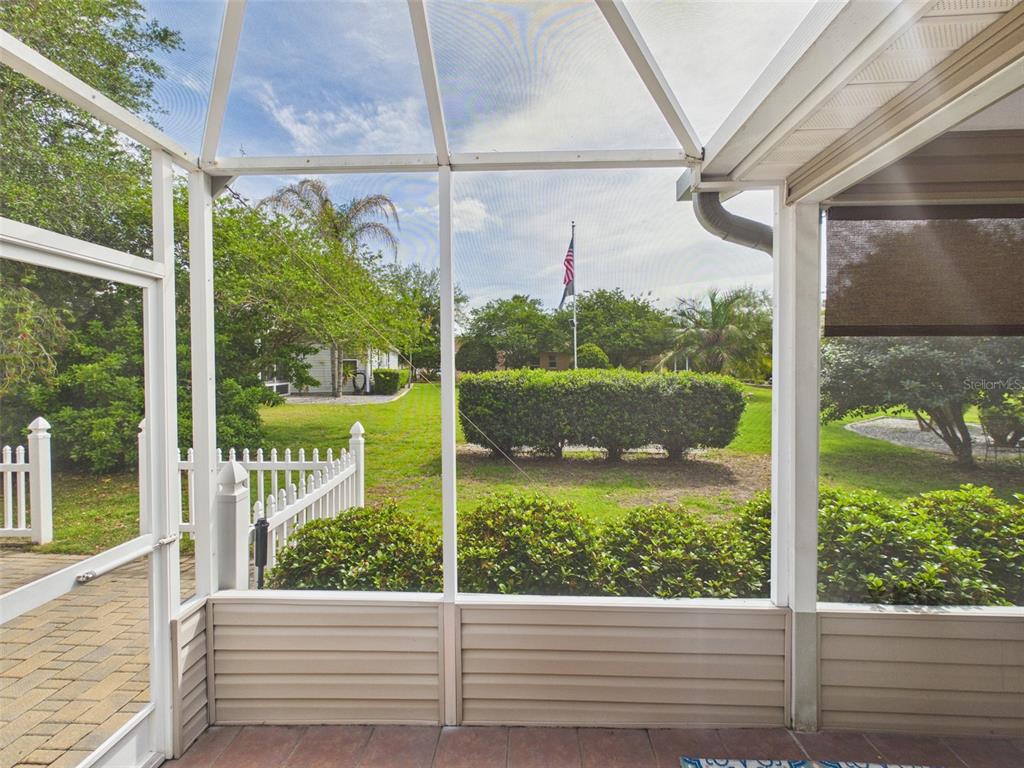 2297 Welcome Way The Villages, FL 32162 - Photo 12 of 36 a view of a glass door with a from a window